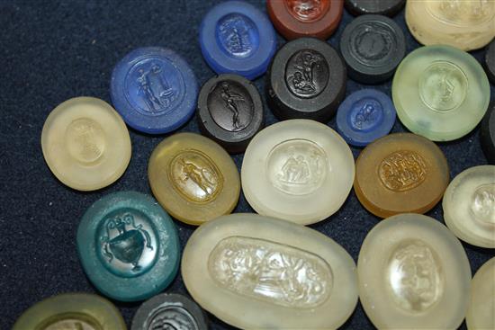 A collection of thirty seven various unmounted hardstone and glass Grand Tour intaglios, largest 1.5in.